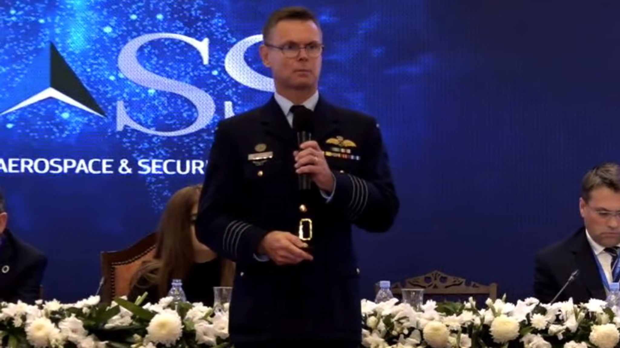Lyle Holt addressing the GSTAR 2020 international conference on strategic threat and response, Centre for Aerospace and Security Studies backdrop