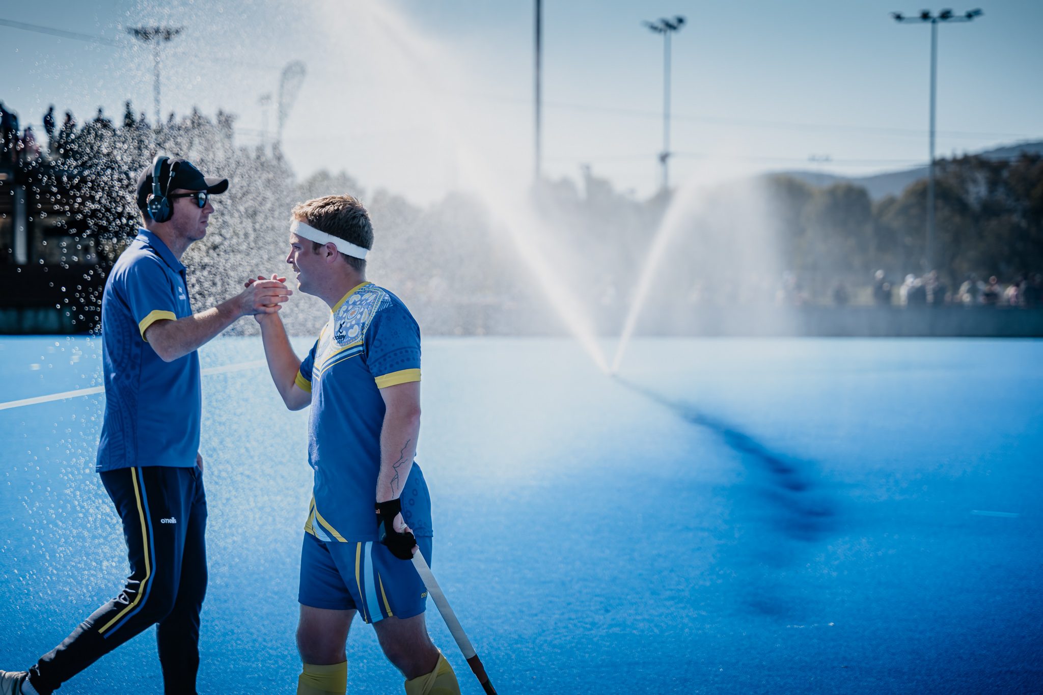 Hockey ACT coach and player after the match