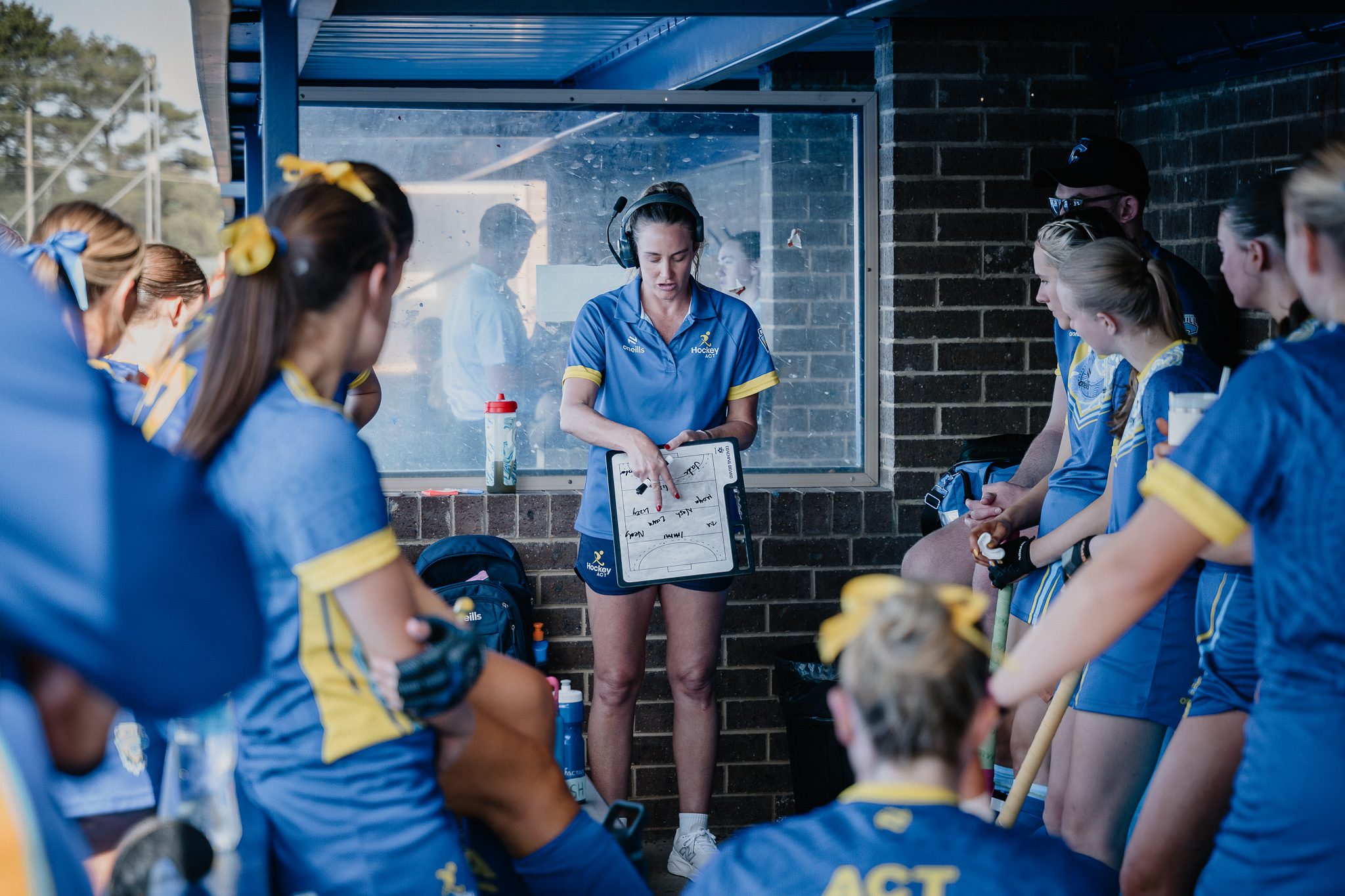 Hockey ACT head coach briefing the team