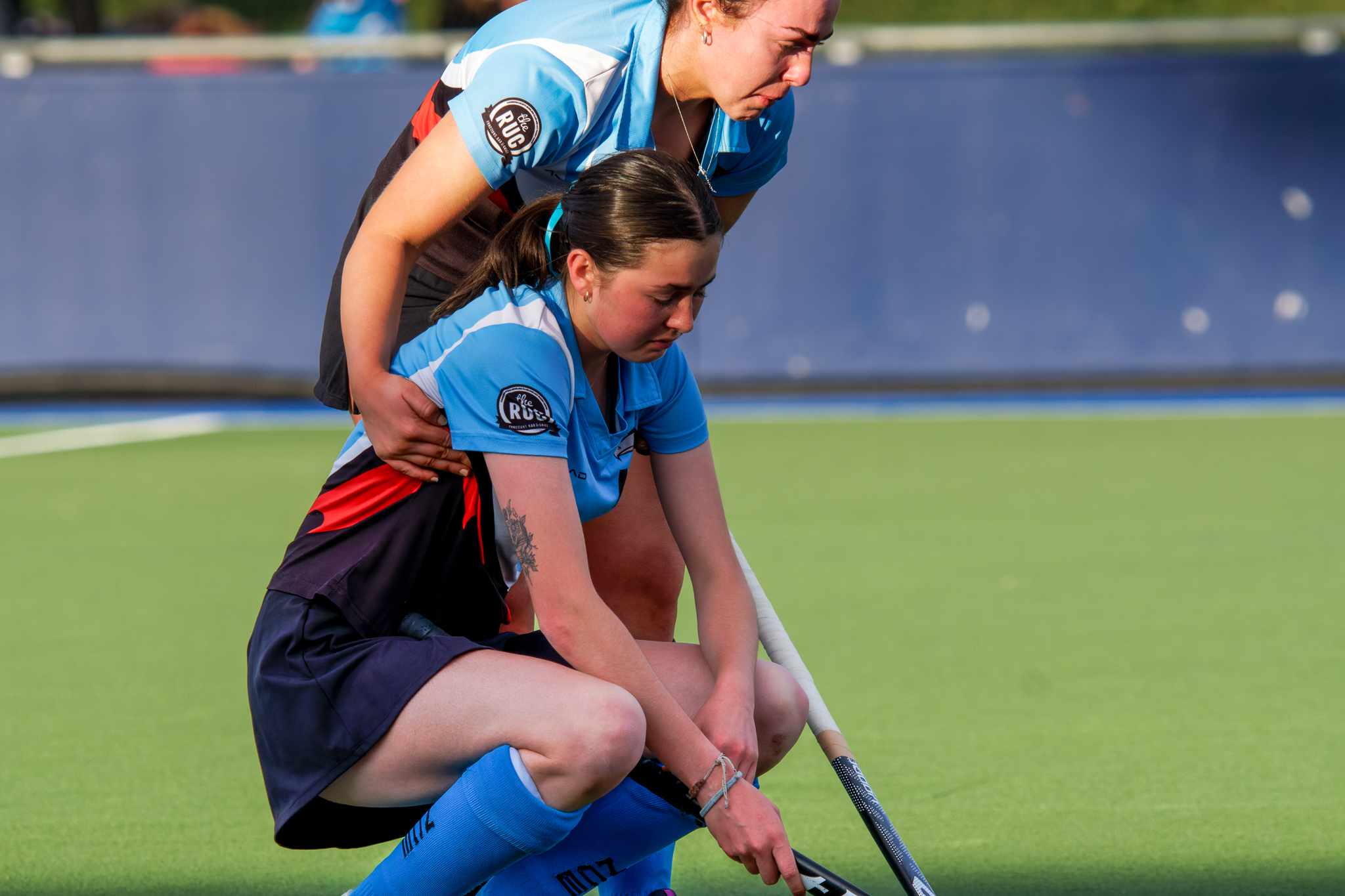 Hockey ACT senior women's grand final, losing side players embrace after the loss