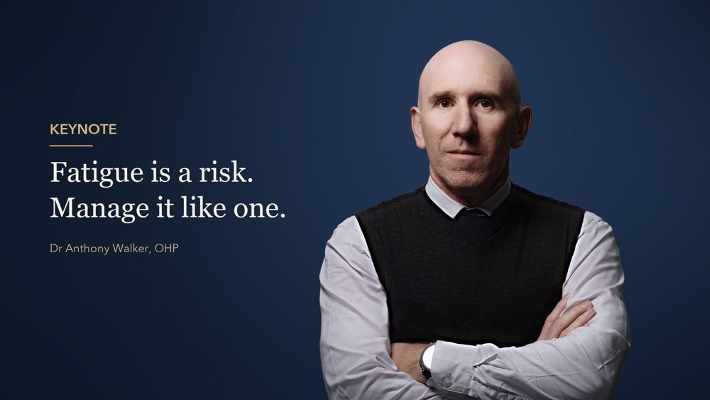 Wide portrait of Dr Anthony Walker with space on the left for a headline in OHP colours