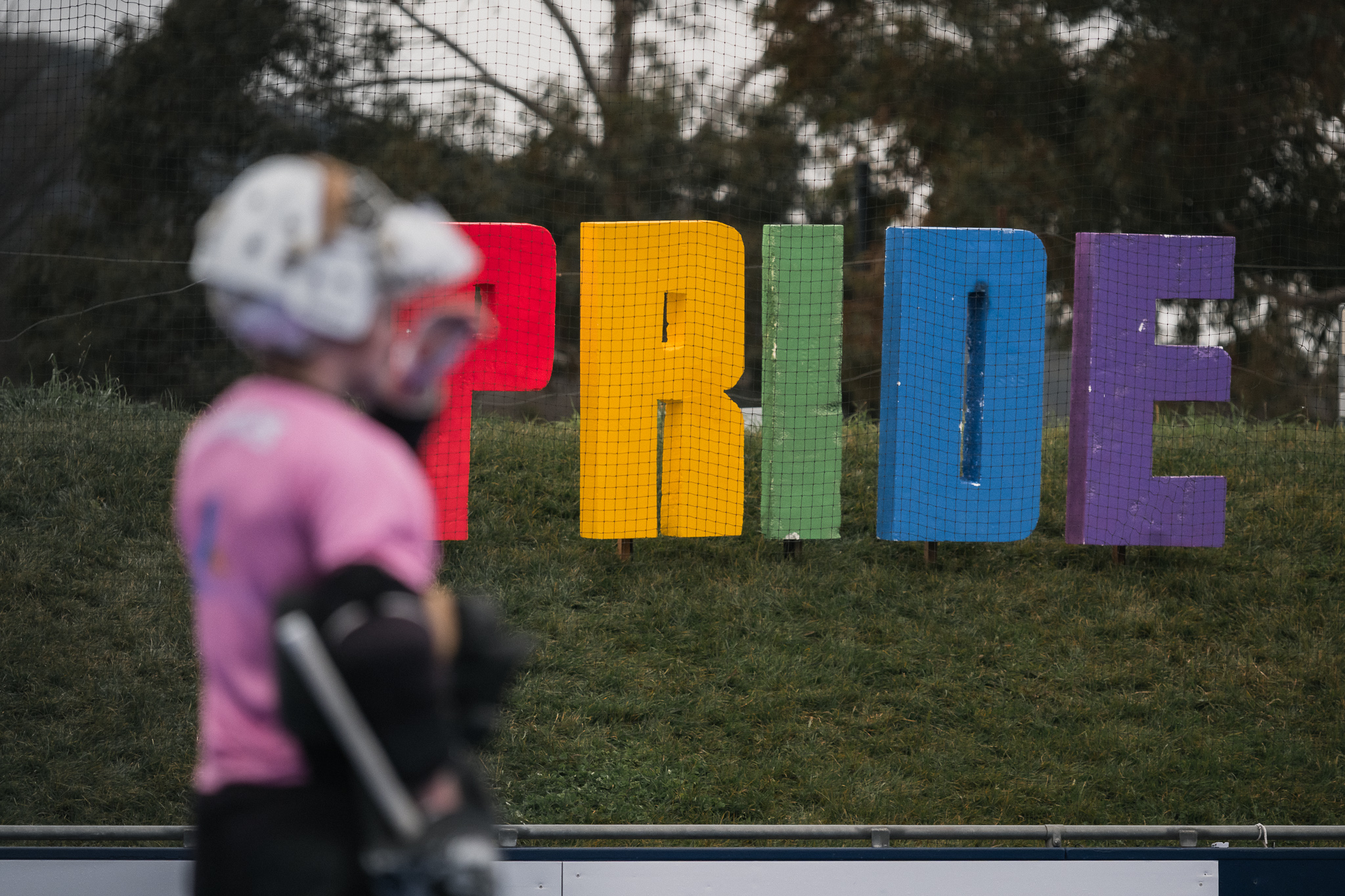 Hockey ACT Pride Round — goalkeeper with PRIDE signage, institutional values documentation