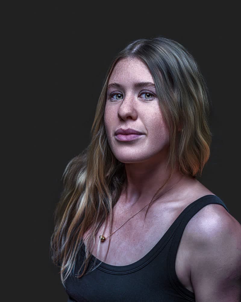 Hockey ACT pathway athlete identity portrait, hair down, controlled studio lighting