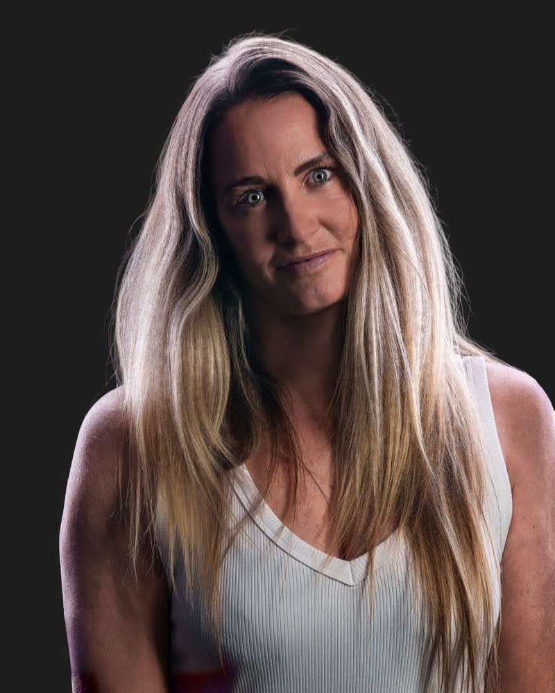 Hockey ACT pathway athlete standing square to camera, rim-lit identity portrait