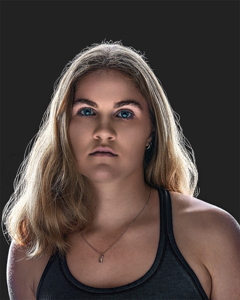 Hockey ACT pathway athlete, front-on identity portrait under single-source lighting